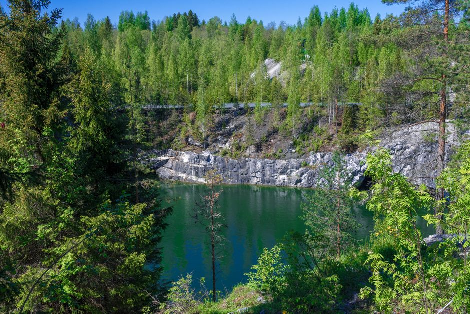 Beautiful lake surrounded by forested cliffs in Ruskeala, Karelia, Russia.