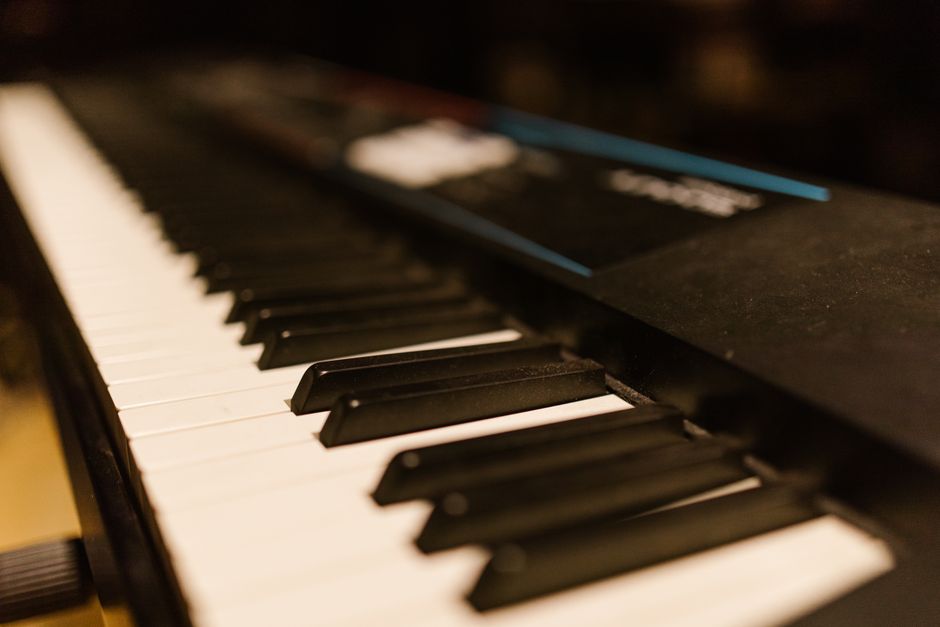 Detailed close-up of piano keys on an electronic keyboard. Perfect for music-related content.